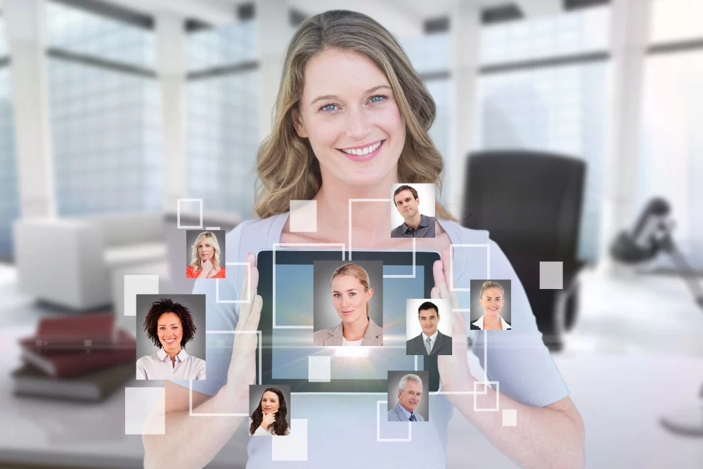 smiling businesswoman showing her tablet with virtual app